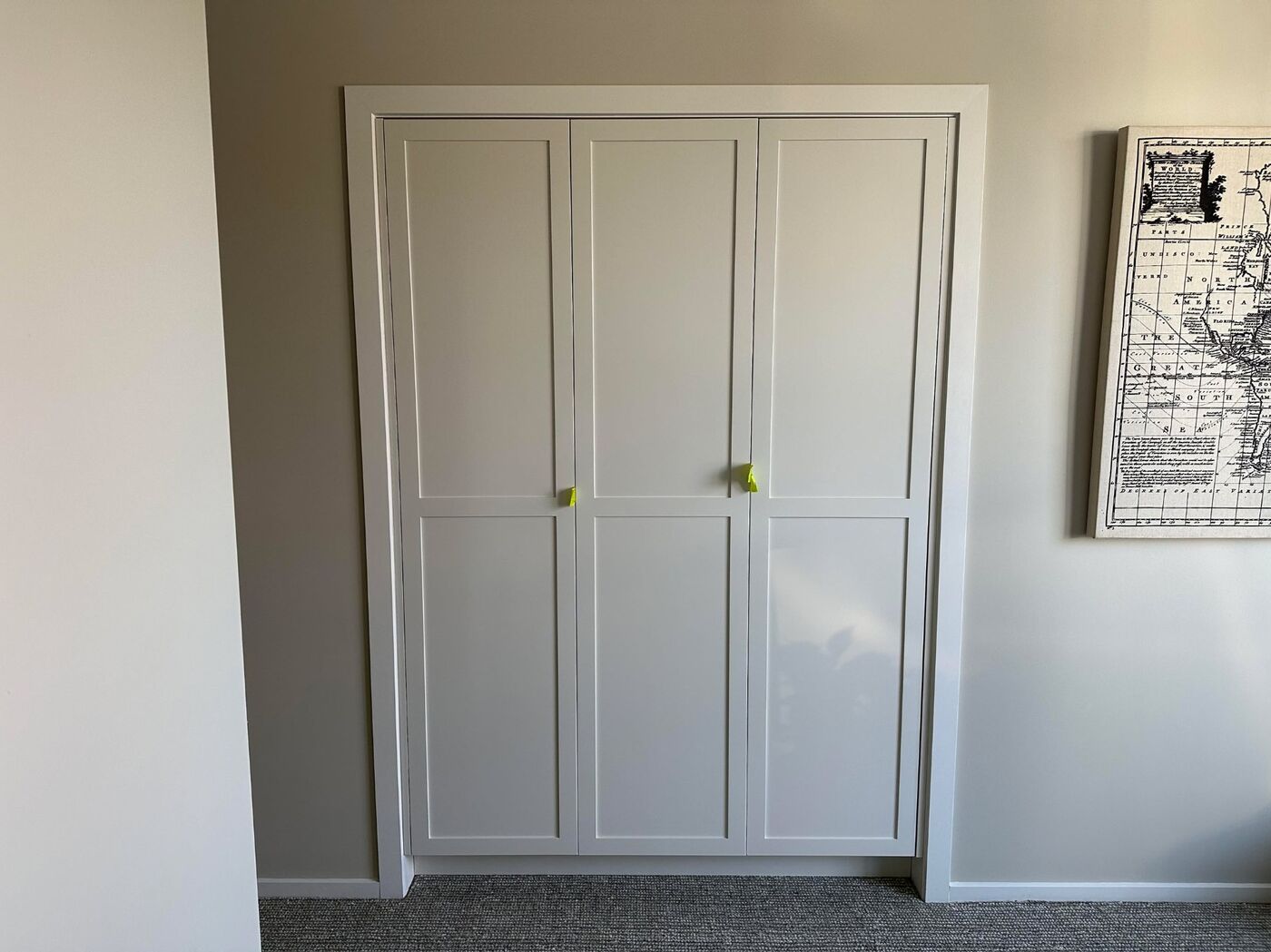 Walk-in wardrobe with shoe cubbies and shaker doors