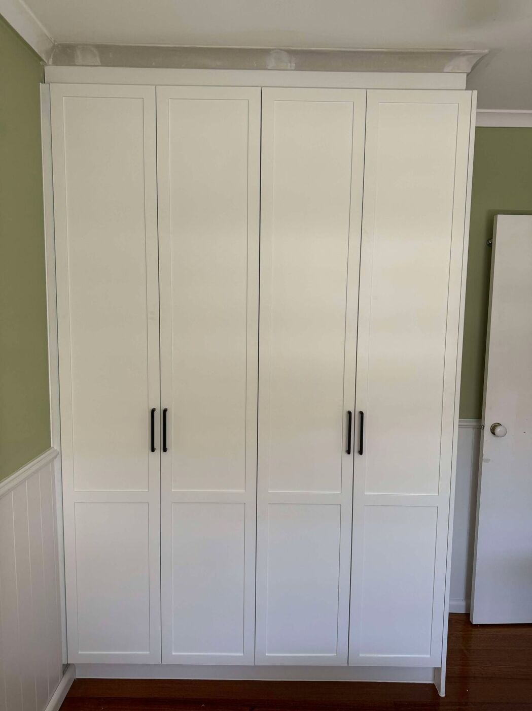 Four-door wardrobe sliding doors in classic shaker style